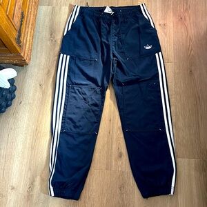 Adidas pants navy white stripes , worn once , very stylish.